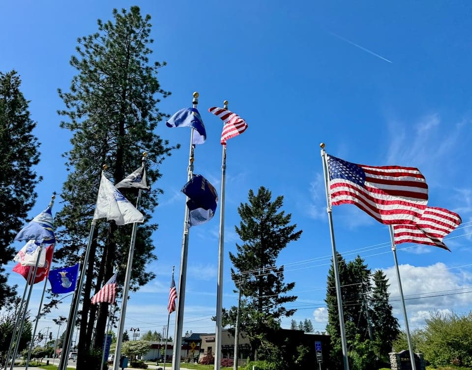 Flags flying on a clear day in Hayden, Idaho
